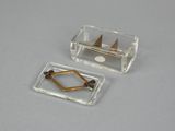 two pieces of glass that have been placed on a table