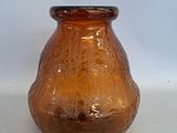 a glass vase that is sitting on a table