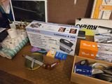 a desk with a lot of office supplies on it