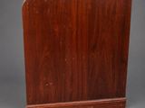 a wooden book stand with a wooden base on a gray background