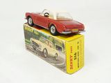 a red toy car sitting on top of a box