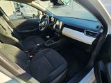 the interior of a car with the door open and the driver ' s seat down