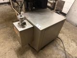 a machine that is sitting on the ground in the garage