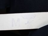 a label on the back of a black shirt