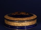 an image of a blue and gold box on a black background