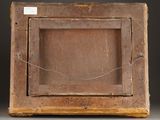 an old wooden box with a label on it sitting on a table