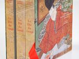 deux livres dans une boîte, surmontés d'un ruban rouge