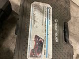 a box that is sitting on the floor with tools in it