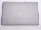 dell laptop computer sitting on top of a table with a white background