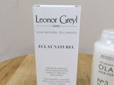 an image of a bottle of lotion and a box of lotion on a table