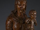 an image of a statue of a woman holding a baby