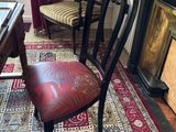 a chair sitting in front of a fireplace in a living room