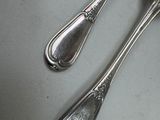 two spoons and a spoon on a table