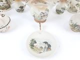 a lot of vases that are sitting on a table