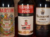 several bottles of wine are lined up on a table