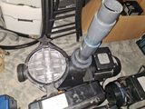 a pile of assorted electrical equipment on the floor