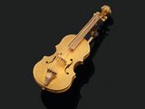 une broche en forme de violon dorée sur un fond noir