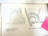 an open book with a drawing of a spiral staircase on it