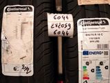 two tires with stickers on them are on display in a store