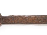 an old wooden pipe with a rope around it on a white surface