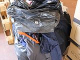 a pile of luggage sitting on top of a pile of boxes