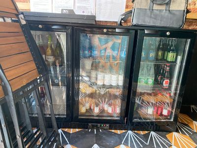 a glass door that is open on the outside of a store