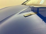 a close up of a car ' s hood with a sticker on it
