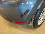 a close up of a car ' s bumper with a sticker on it