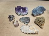 many different types of rocks on a table