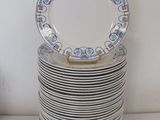 many plates stacked on top of each other on a table