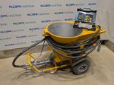 une machine jaune posée sur le sol