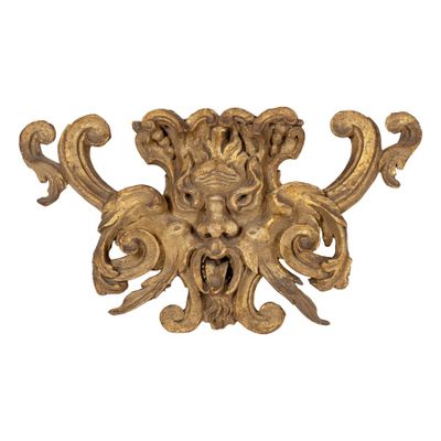 an image of a gold sculpture of a man ' s face on a white background