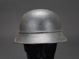 a silver helmet on a mannequin head