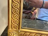 a man taking a picture of himself in a mirror