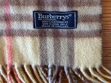 plaid blanket on a wooden table with a blue label on it