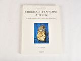 a book with a picture of a cat sitting on top of it