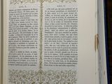 an open book that has a picture of a tree on it