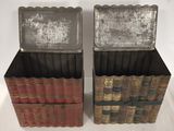 two old books are stacked on top of each other on a white surface