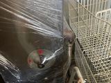 a large metal container sitting on top of a metal rack