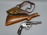 a gun and a purse on a table