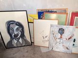 many framed pictures of a woman on the floor
