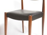 pair of mid - century danish modern teak and black leather dining chairs