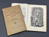 un livre ouvert posé sur une table à côté d'un livre ouvert