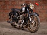 a motorcycle that is parked in front of a brick wall