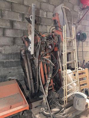a pile of old tools and tools in a garage