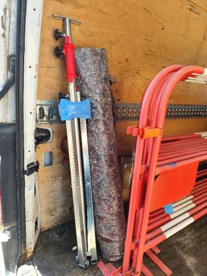 a red bench and a red chair in the back of a van