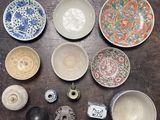a lot of different bowls and bowls on the table