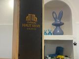 a wooden box that has a black label on it