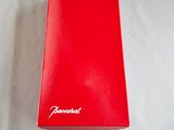 an empty red box sitting on top of a white sheet