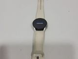 a close up of a smart watch on a white surface